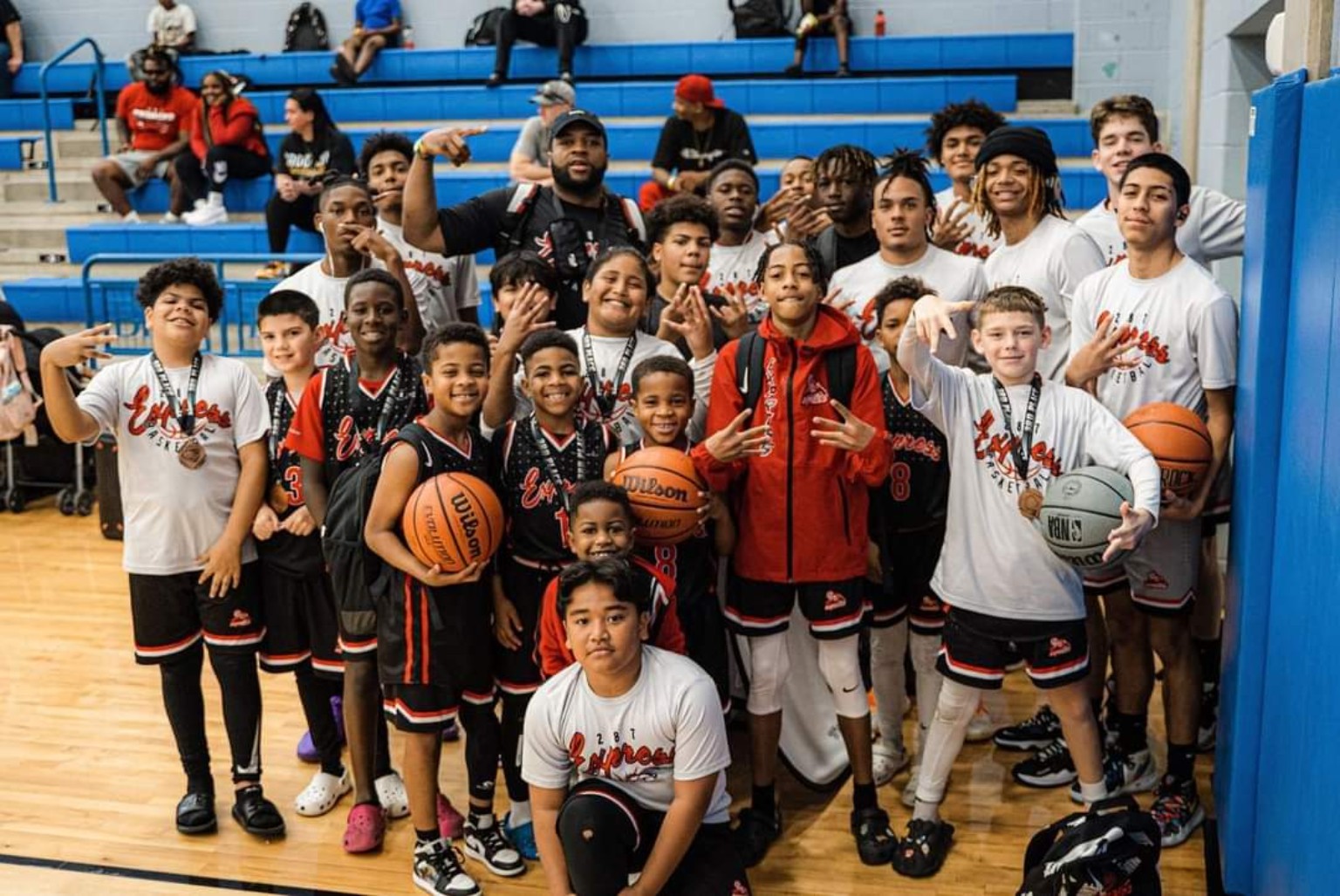 287 Express players and coaches together in a gym